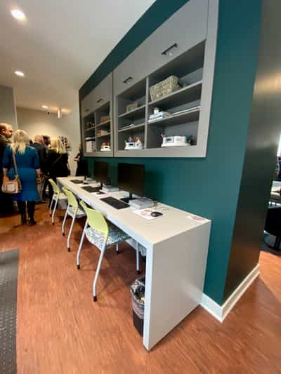 Bank of computers available to residents at Harbour House. Work table and chairs provided by Kentwood Office Furniture.